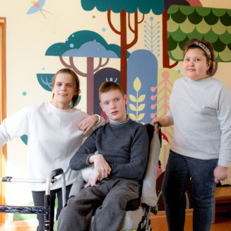 three people smiling